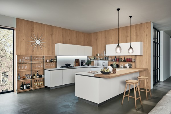 The spirit of a futuristic design.
A kitchen that makes minimalism its trump card, offering a new solution for functionality requirements. Its outstanding features include its pure flat door, the up-